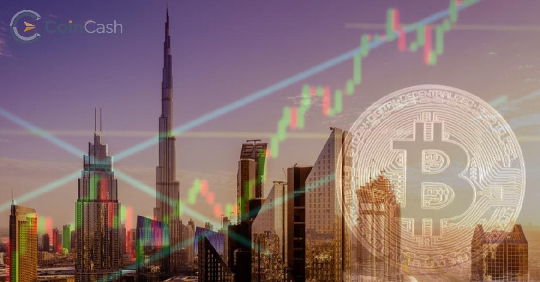 Dubai felhőkarcolók és bitcoin árfolyam a háttérben.